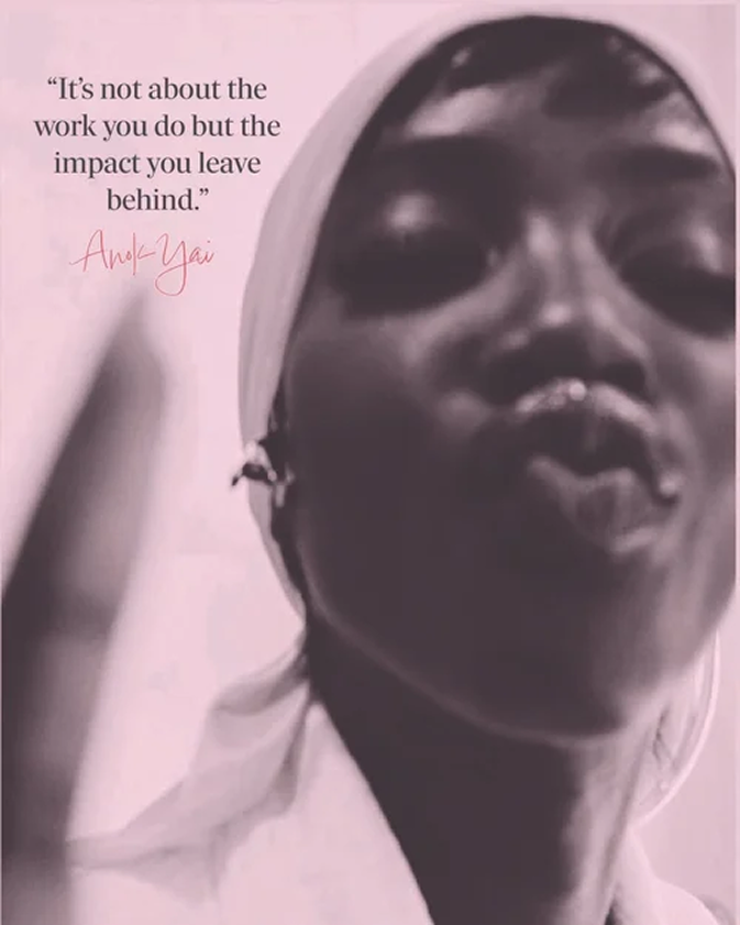 a small zine snapshot of the model Anok Yai on a pink background blowing a kiss to the camera with text on the top right corner that says it's not about the work you do its about the impact you leave behind